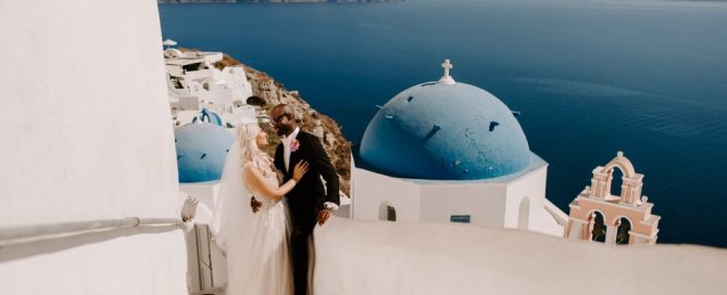 ethnic-destination-wedding-santorini-phosart-photographergreece-greek-island-blue-sea-aegean-Bride-and-groom-couple-photography-blue-domes-oia-love-1